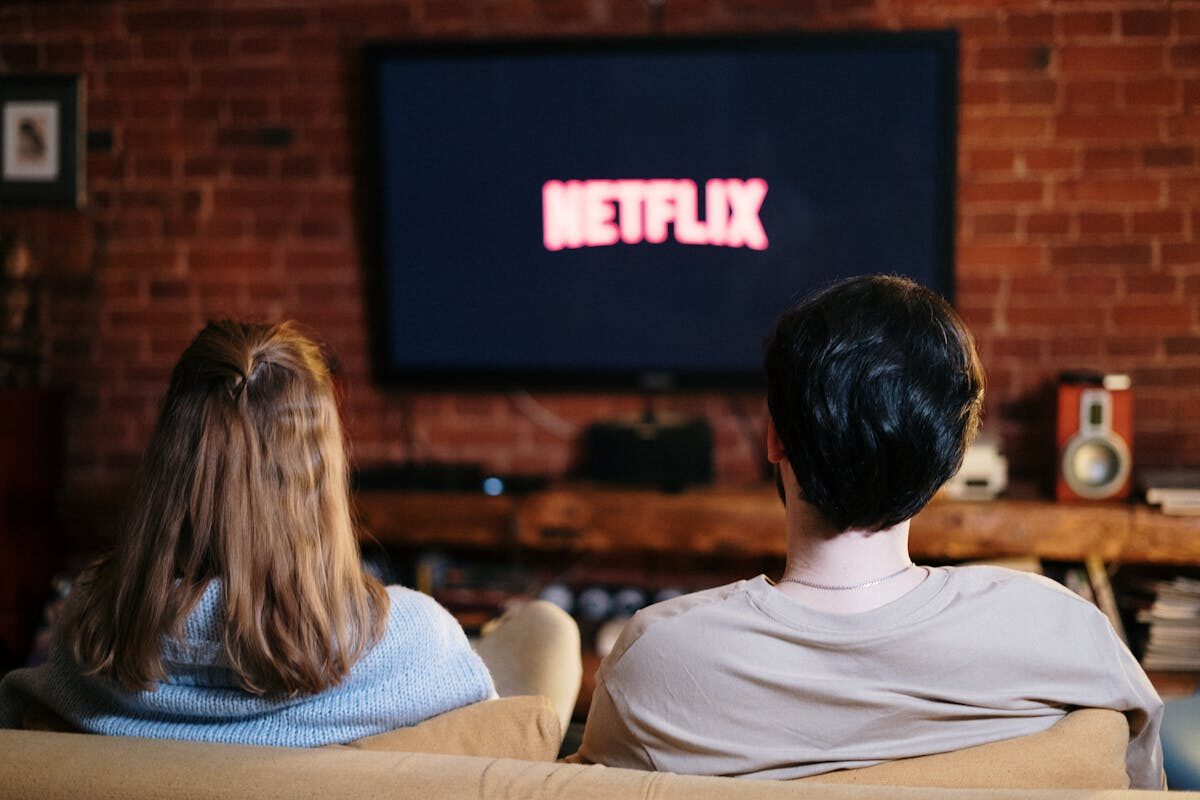 Couple watching Netflix in living room