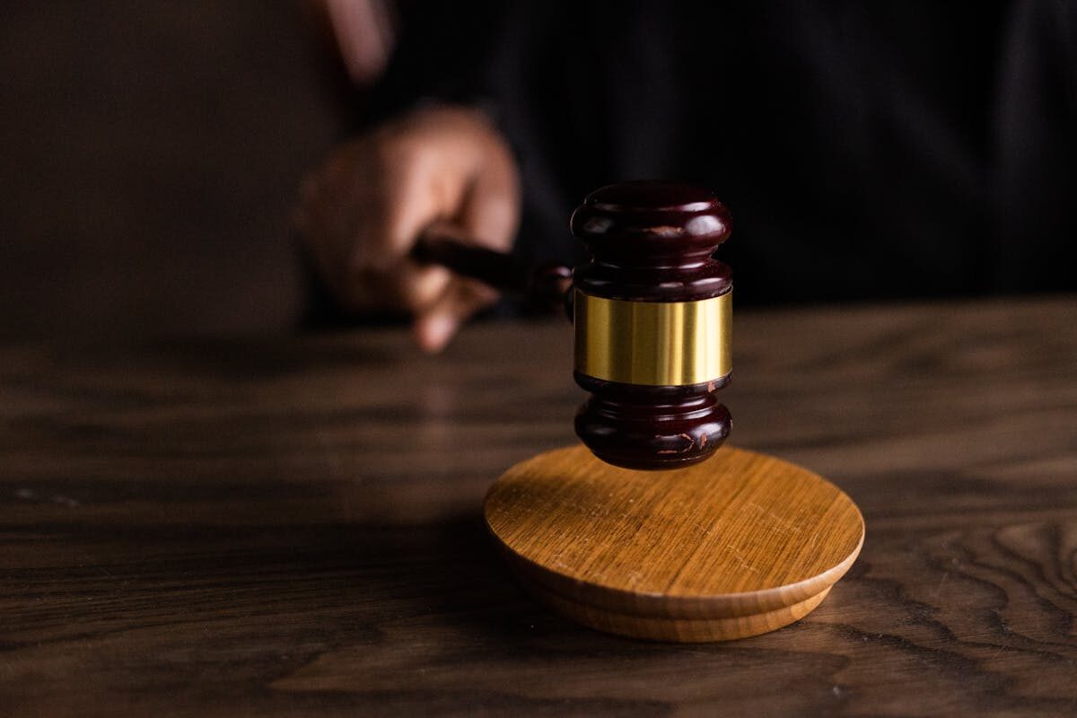 Wooden gavel on courtroom table
