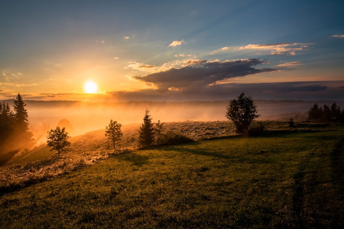 Beautiful golden sunrise over landscape with warm morning light